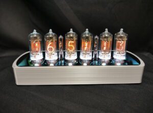 Front view of Genesis SS in silver with backlit nixie tubes