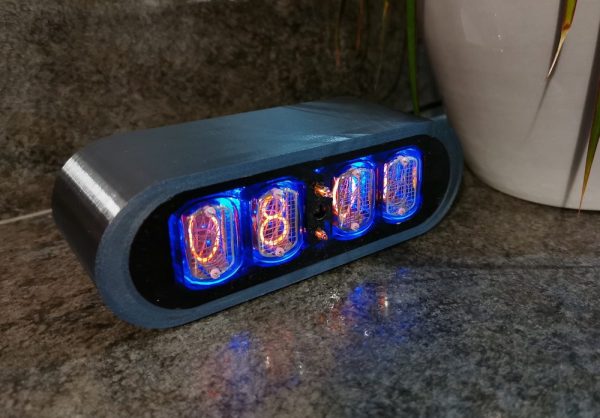 Closeup of POD 3D printed clock in Chrome, showing finish of the case