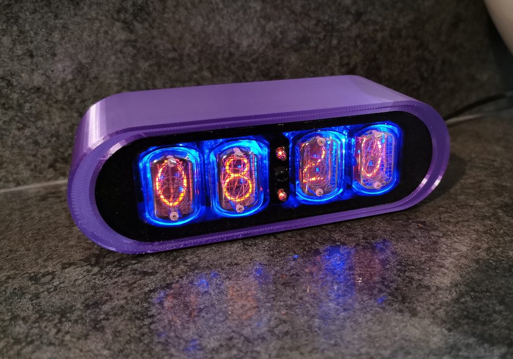 POD nixie clock with purple 3D printed case, and 4 nixie tubes to display the time