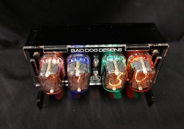 View of junior clock from above showing colourful lit nixie tubes which are displaying the time