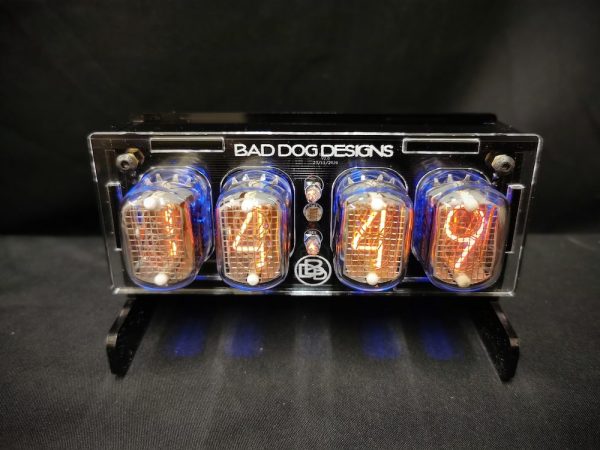 Junior nixie clock with a layered acrylic case in black and clear, and 4 In-12 Nixie tubes which display the time or date as required