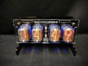 Junior nixie clock with a layered acrylic case in black and clear, and 4 In-12 Nixie tubes which display the time or date as required