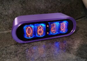 POD nixie clock with purple 3D printed case, and 4 nixie tubes to display the time