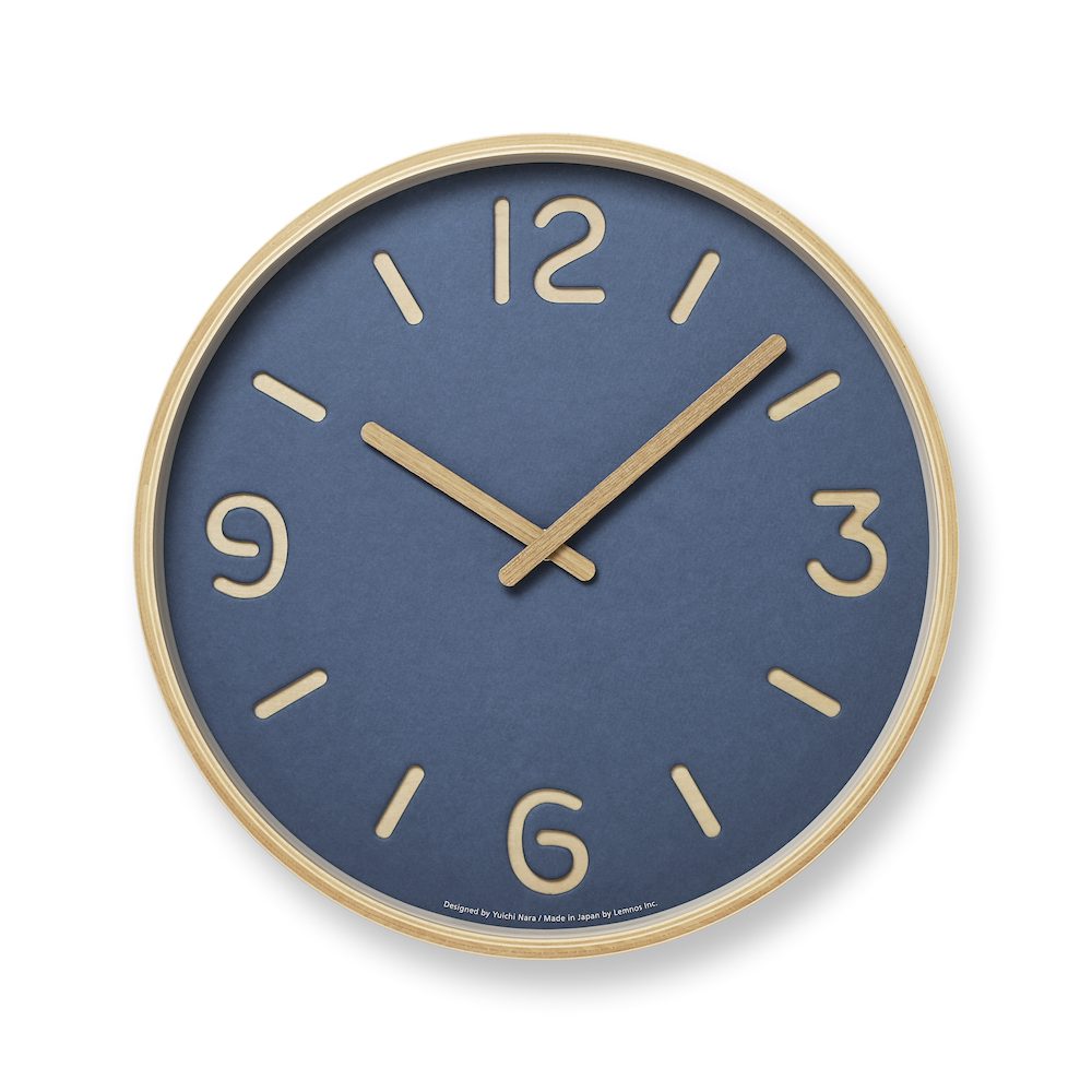Beautiful Thomson Paper in Blue over wood, with organically formed numbers and wooden hands
