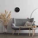 Black and White classic wall clock shown in a modern room setting