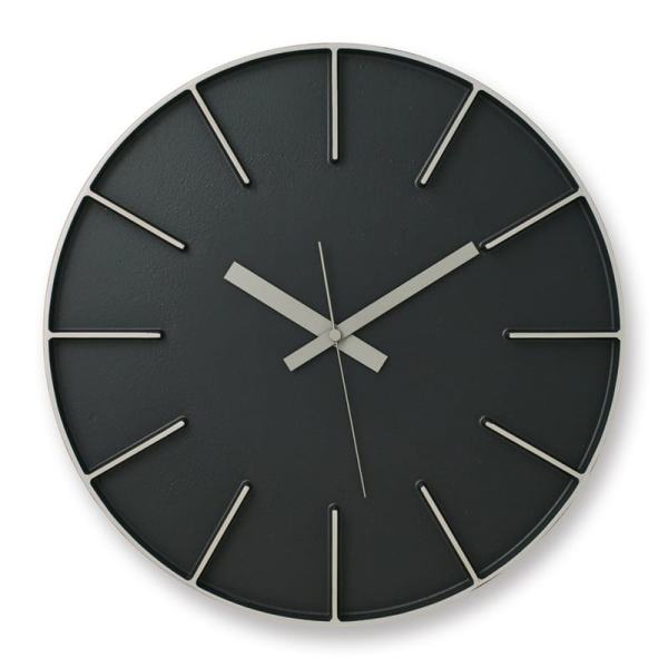 A stunning black cast aluminium clock with black face.