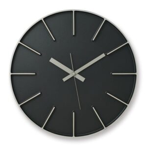 A stunning black cast aluminium clock with black face.