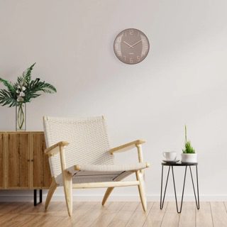 Shade wall clock shown in a modern room setting