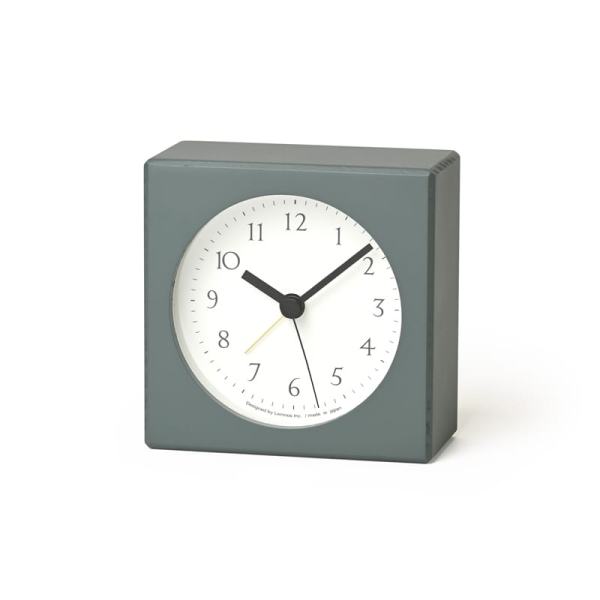 The nuan alarm clock in a subtle and natural green, with white face and black detail