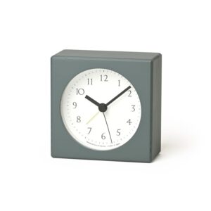 The nuan alarm clock in a subtle and natural green, with white face and black detail